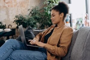 Woman using computer at home
