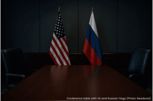 Conference table with US and Russian flags