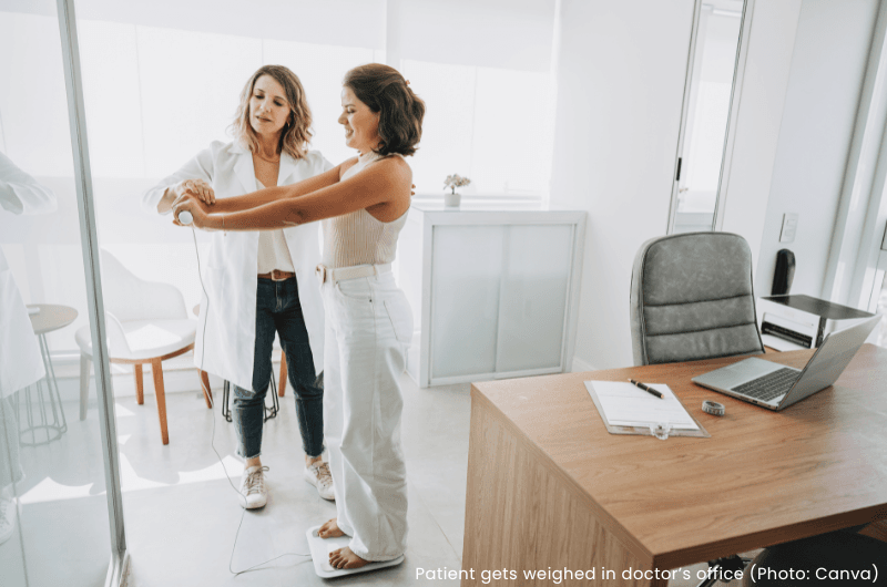 Patient gets weighed in doctor's office