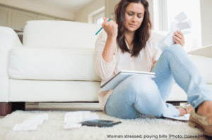 Woman stressed paying bills