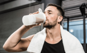 Man drinking protein shake.