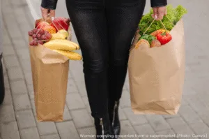 Woman carrying groceries from supermarket