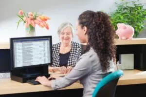 A bank teller assisting a customer