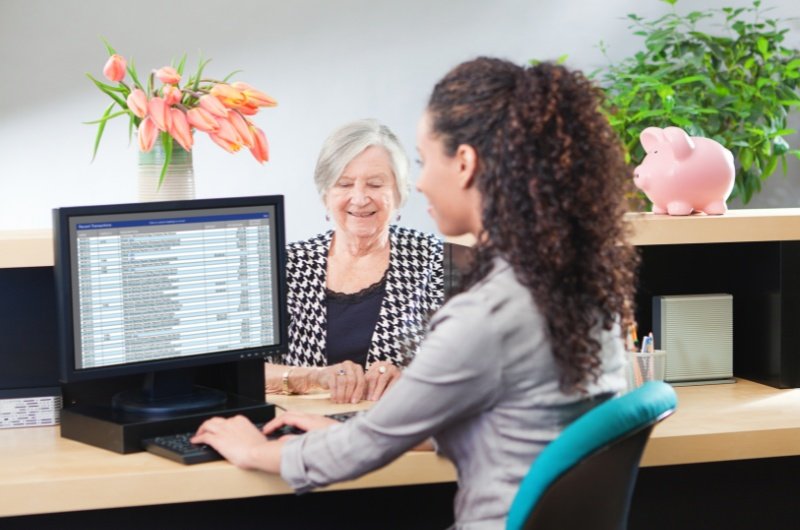A bank teller assisting a customer