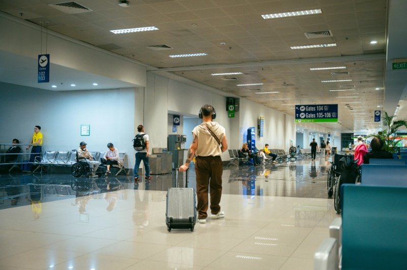 Modern airport terminal with passengers