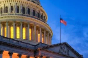 The US Capitol building at dusk.