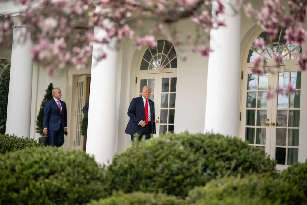 President Donald Trump walks along the West Wing colonnade of the White House.