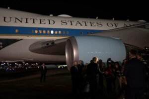 President Donald Trump boards Air Force One at Palm Beach International Airport in West Palm Beach, Florida.