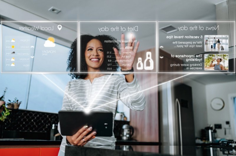 A woman uses an AI-powered digital assistant to manage daily tasks — a glimpse into how intelligent agents are transforming everyday life.