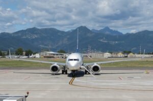 A Boeing 737 airplane lands at airport.