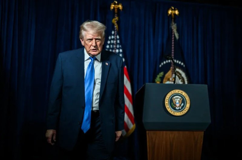 President Donald Trump leaves podium after a speech.