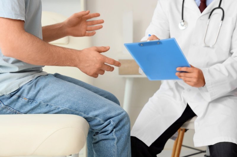 Young man visiting doctor at medical facility