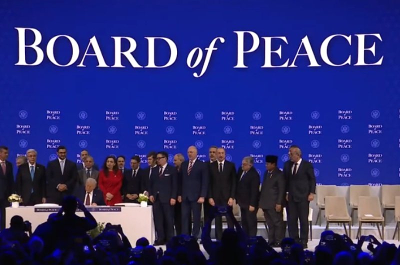 President Trump signs the Board of Peace agreement during a formal ceremony in Switzerland, launching a new U.S.-led foreign policy initiative.
