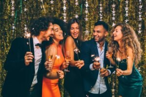 Group of young adults celebrate the New Year.