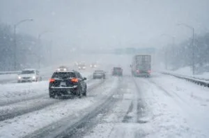 Heavy snowfall blankets a major U.S. highway as a powerful winter storm brings dangerous travel conditions across large parts of the country.
