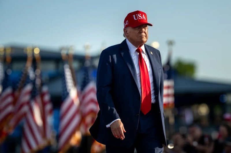 President Donald Trump at a public event. The White House has released new economic data on wages and inflation.