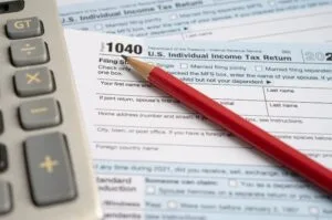 A U.S. individual income tax return form with calculator.