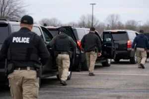 Federal agents prepare to depart as the Trump administration pulls back 700 immigration agents from Minnesota amid protests and mounting pushback.