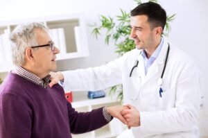 A physician speaks with a patient during a routine office visit.