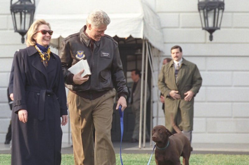 Former President Bill Clinton and Former Secretary of State Hillary Clinton photographed while walking their dog.