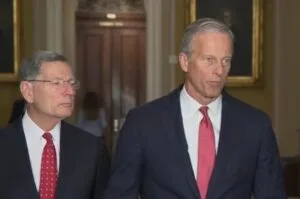 Sen. John Thune addresses reporters on Capitol Hill about bipartisan talks to avert a potential DHS funding lapse.