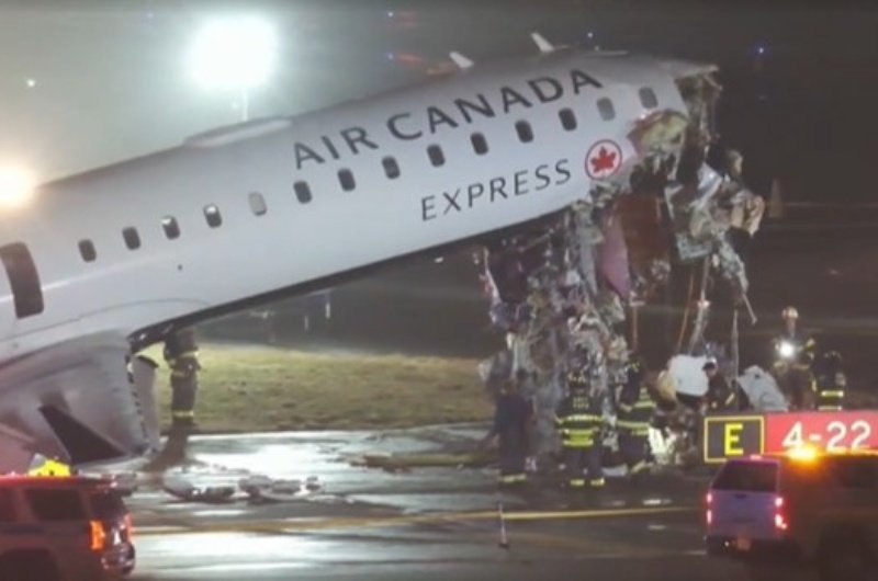 Emergency crews respond to the scene after an Air Canada Express aircraft collided with a fire truck on the runway at LaGuardia Airport, forcing a full shutdown of the major travel hub.