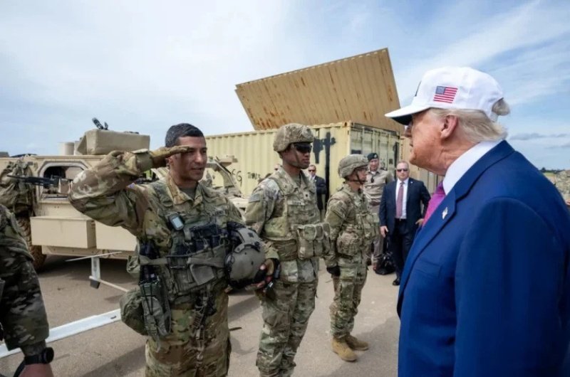 President Trump speaks with U.S. troops as additional forces are positioned in the Middle East, amid growing debate in Washington over deeper involvement.