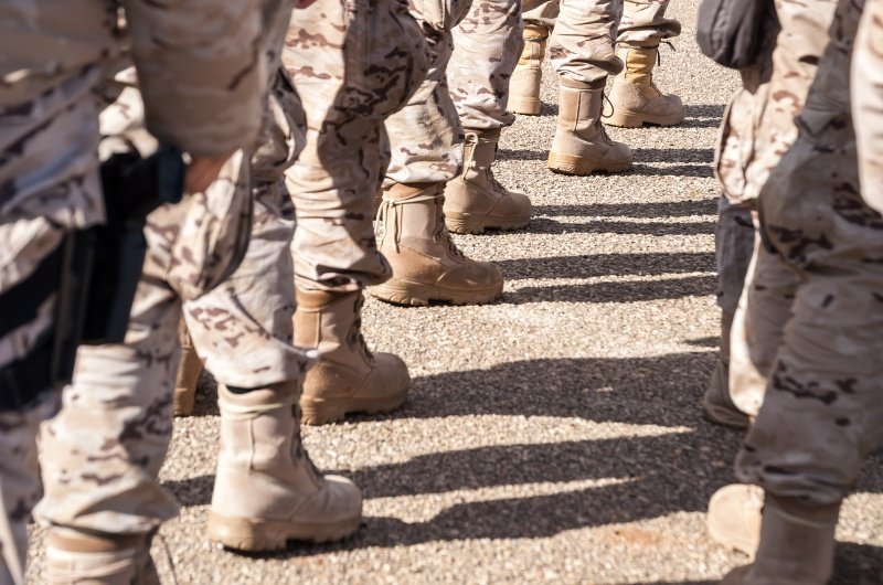 Boots on the ground reflect the human reality behind military readiness, as U.S. officials consider changes to how future service members are identified and prepared.