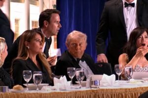 President Trump and guests react during a dramatic moment at the White House Correspondents’ dinner in Washington.