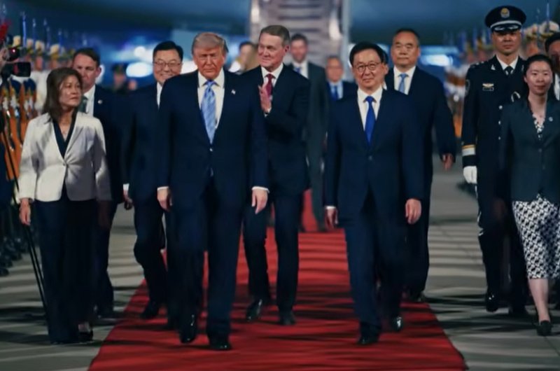 President Donald Trump and Chinese President Xi Jinping walk together during a high-stakes summit in Beijing focused on trade, AI, and global tensions.