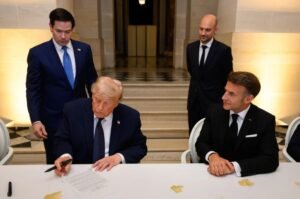 President Donald Trump signs the U.S.-Iran Memorandum of Understanding at the Palace of Versailles in France on June 17, 2026.
