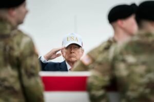 President Donald Trump salutes during a dignified transfer ceremony for fallen U.S. service members at Dover Air Force Base in March 2026. The U.S. military has identified two additional American soldiers killed in a recent attack in Jordan that prompted an expanded military response.