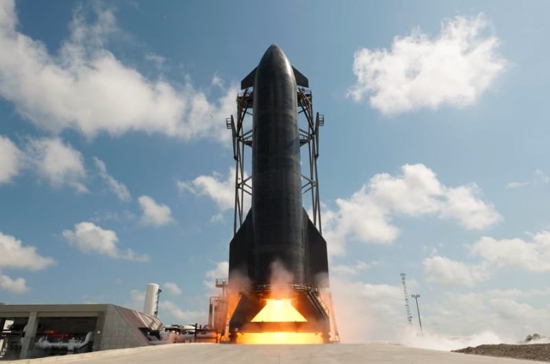 SpaceX's Starship rocket ignites its engines during launch preparations at Starbase in Texas ahead of Flight 13, the company's next major test mission following FAA approval.