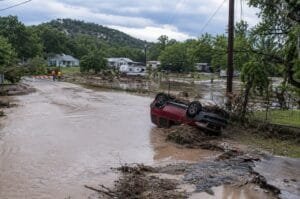 Floodwaters cover a residential area in the Texas Hill Country after more than two feet of rain fell in parts of the region.