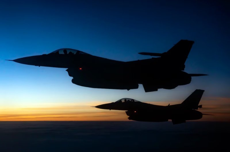 U.S. Air Force F-16 Fighting Falcons fly in formation during a military mission. The aircraft are representative of U.S. air power as regional tensions continue between the United States and Iran.