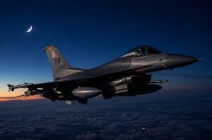 A U.S. Air Force fighter aircraft flies a nighttime mission over the Middle East. The United States carried out a ninth consecutive night of military strikes against Iranian targets following recent attacks on American service members.