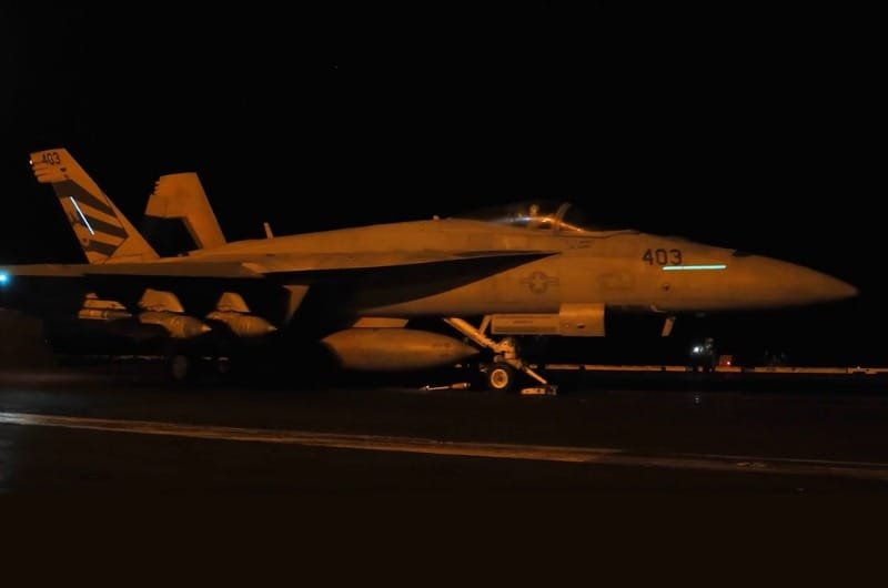 A U.S. Navy fighter jet prepares for nighttime operations as American forces continue strikes against targets in Iran. 