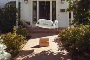 A Zipline delivery drone lowers a food order directly to a customer's home without landing.