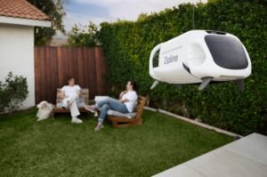 A Zipline delivery drone lowers a package into a residential backyard, offering a glimpse of how autonomous delivery could soon become part of everyday life.