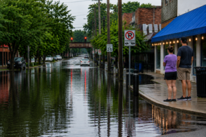 Floodwaters cover a street in Indiana following days of heavy rain and severe storms that caused widespread damage and displaced more than 1,000 residents.