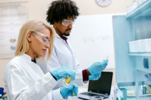 Scientists work in a medical research laboratory as personalized mRNA technology moves closer to a potential new role in cancer treatment.