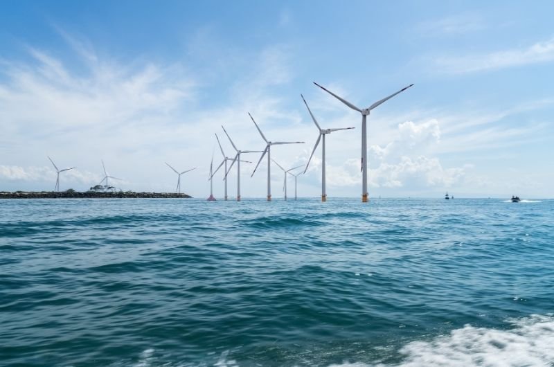 Offshore wind turbines stand along the U.S. coast as the Trump administration moves to scale back offshore wind development in favor of expanded natural gas investment.