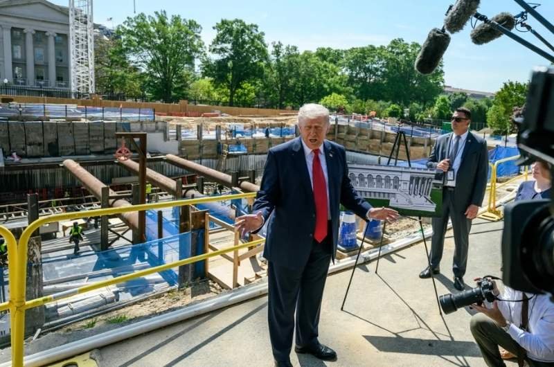 President Trump discusses plans for White House ballroom with reporters at construction site.
