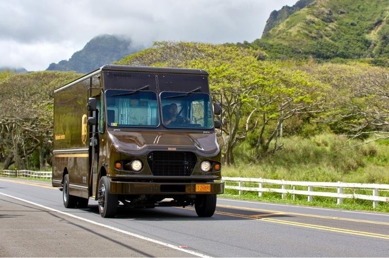 A UPS delivery truck travels along a roadway. Longtime UPS employee Paul Roberts was killed while working at a Missouri facility just 13 days before his planned retirement.