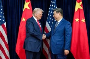President Donald Trump and Chinese President Xi Jinping shake hands as the United States and China move forward with an agreement covering tariff reductions on about $60 billion in traded goods.