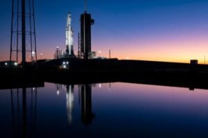 A SpaceX rocket stands at a launch facility as the company prepares to transition its Florida Starlink missions to Starship, its next-generation launch vehicle.