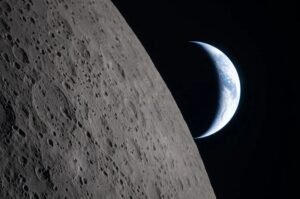 Earth appears beyond the Moon's horizon in a photograph captured by the Artemis II crew during its April 2026 lunar flyby, as NASA prepares for future astronaut missions to the lunar surface.